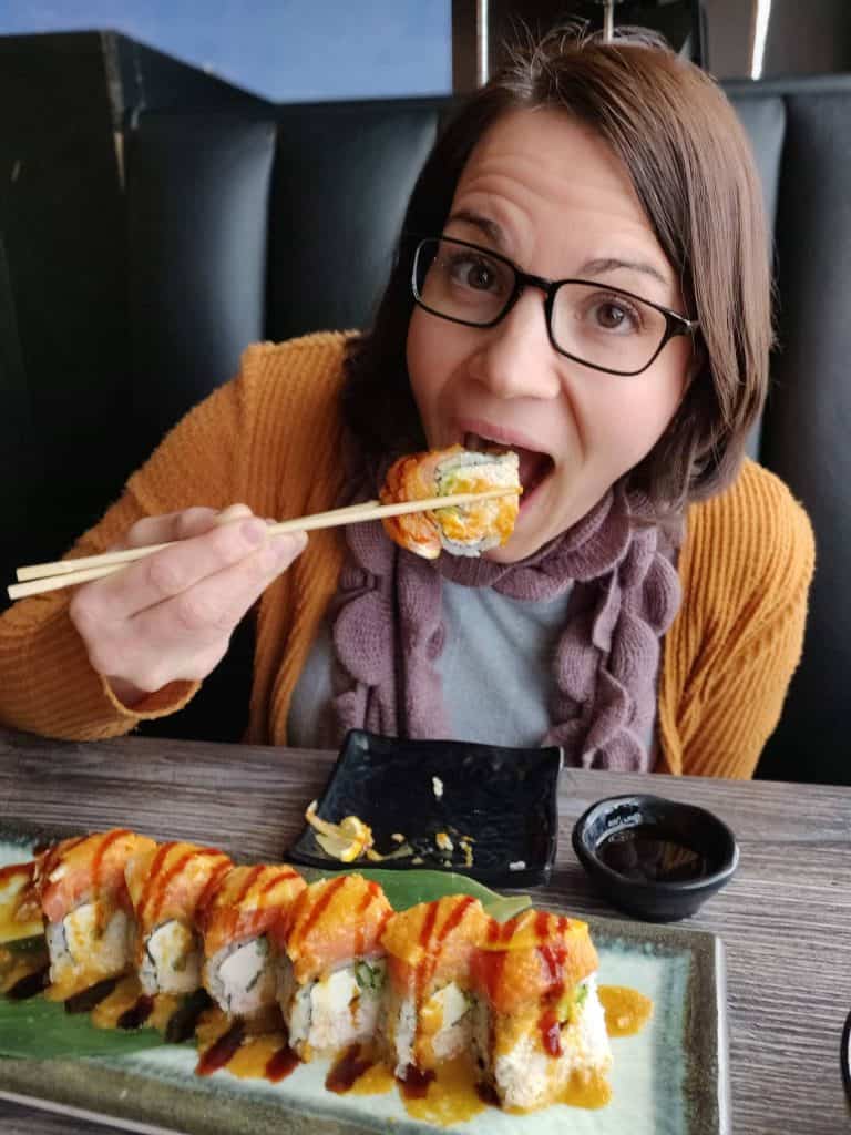 Author enjoying sushi roll