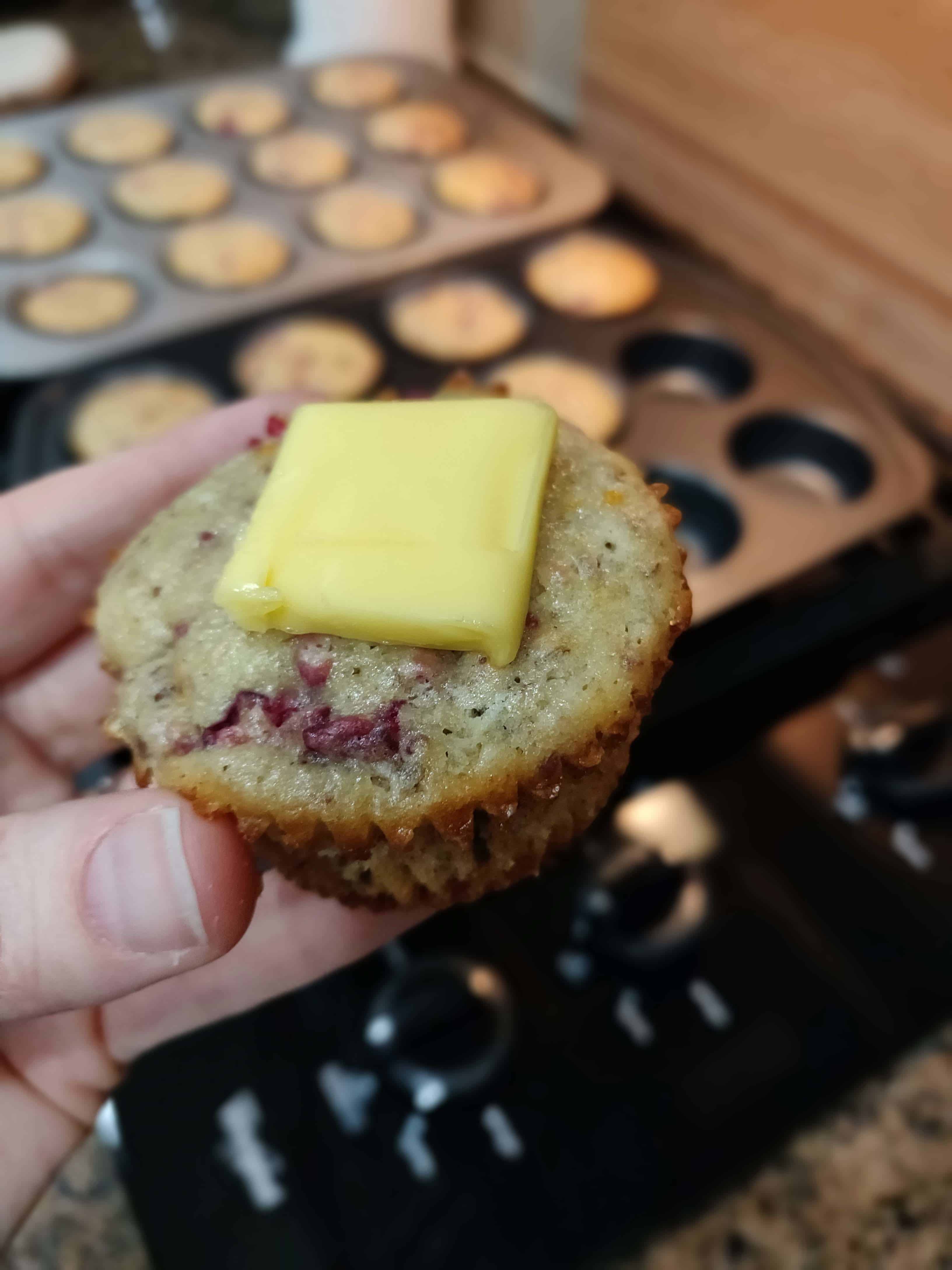 Butter on top of Orange Cranberry Muffin
