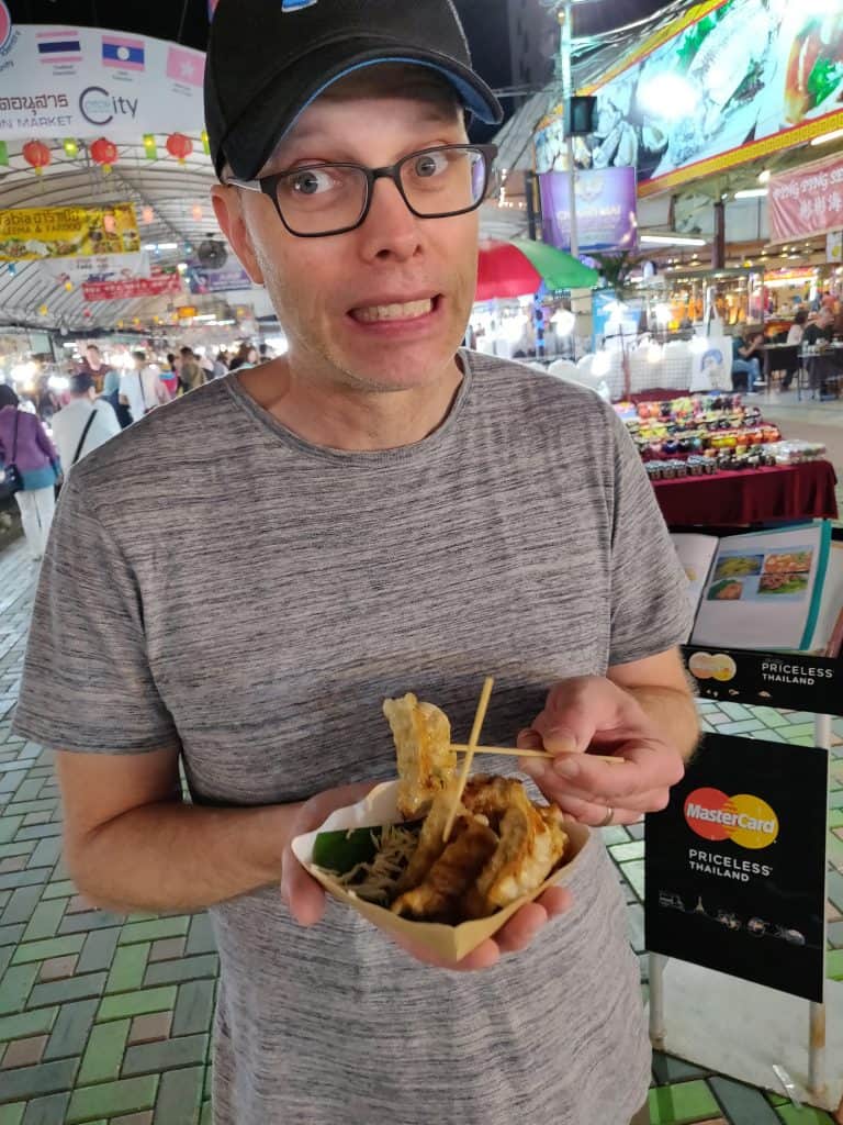 John eating gyoza at Chiang Mai night market