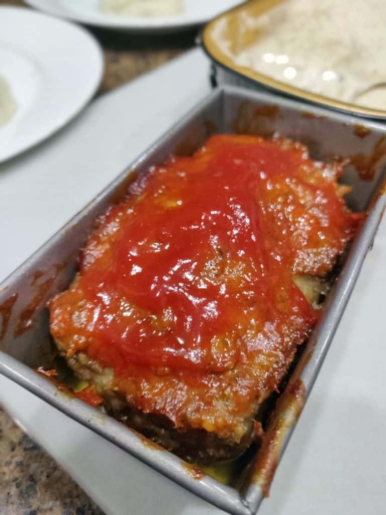 cooked meatloaf in small pan