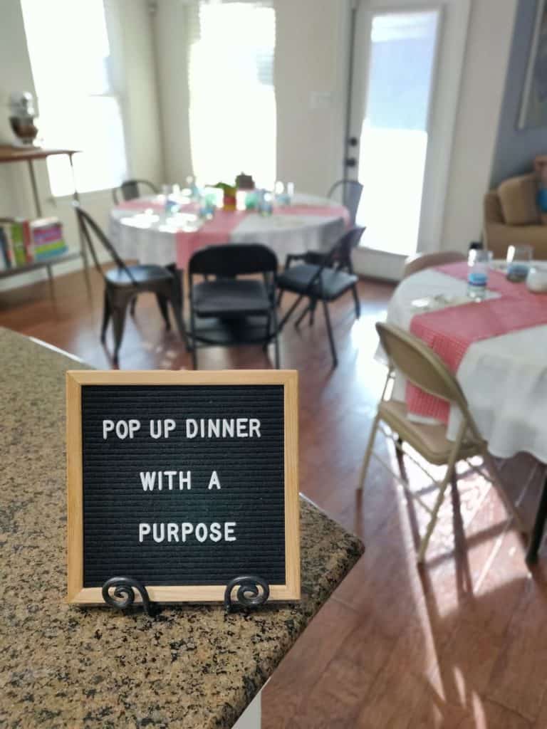 Pop up Dinner with a Purpose sign