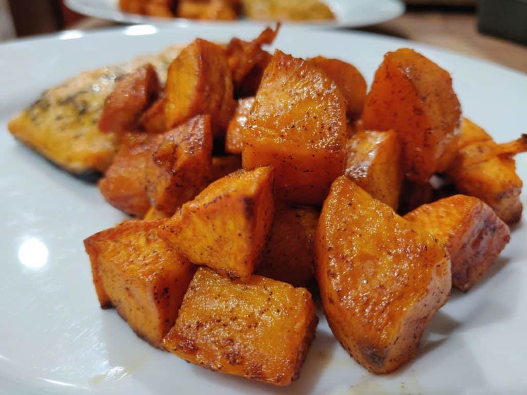 Close up shot of baked sweet potatoes on plate