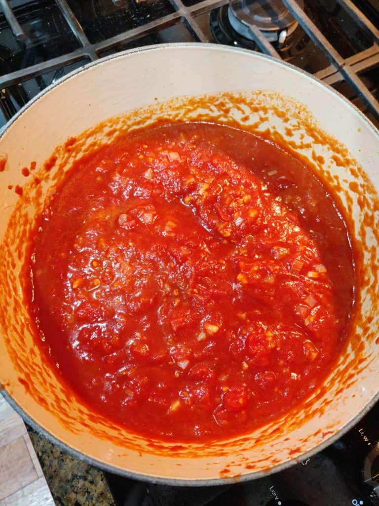 Tomato sauce in pot on stove