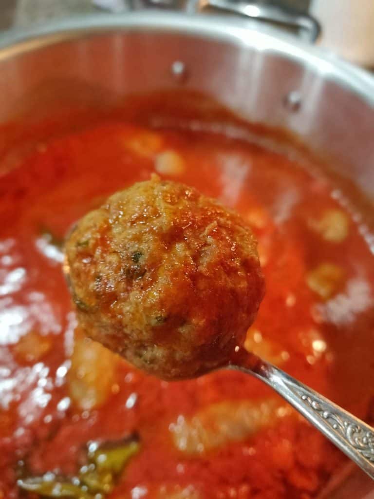 Meatball and sauce on a spoon