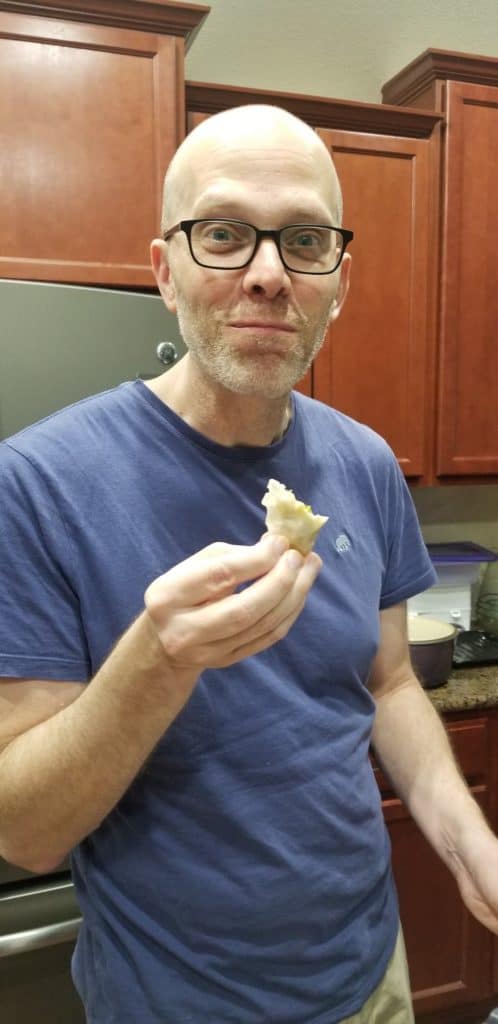John eating a dumpling