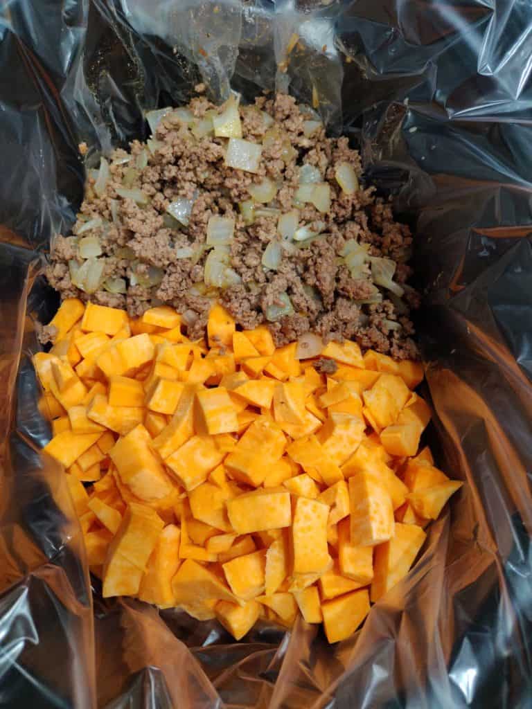 Meat and sweet potatoes in slow cooker