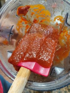 Red Enchilada Sauce on spatula