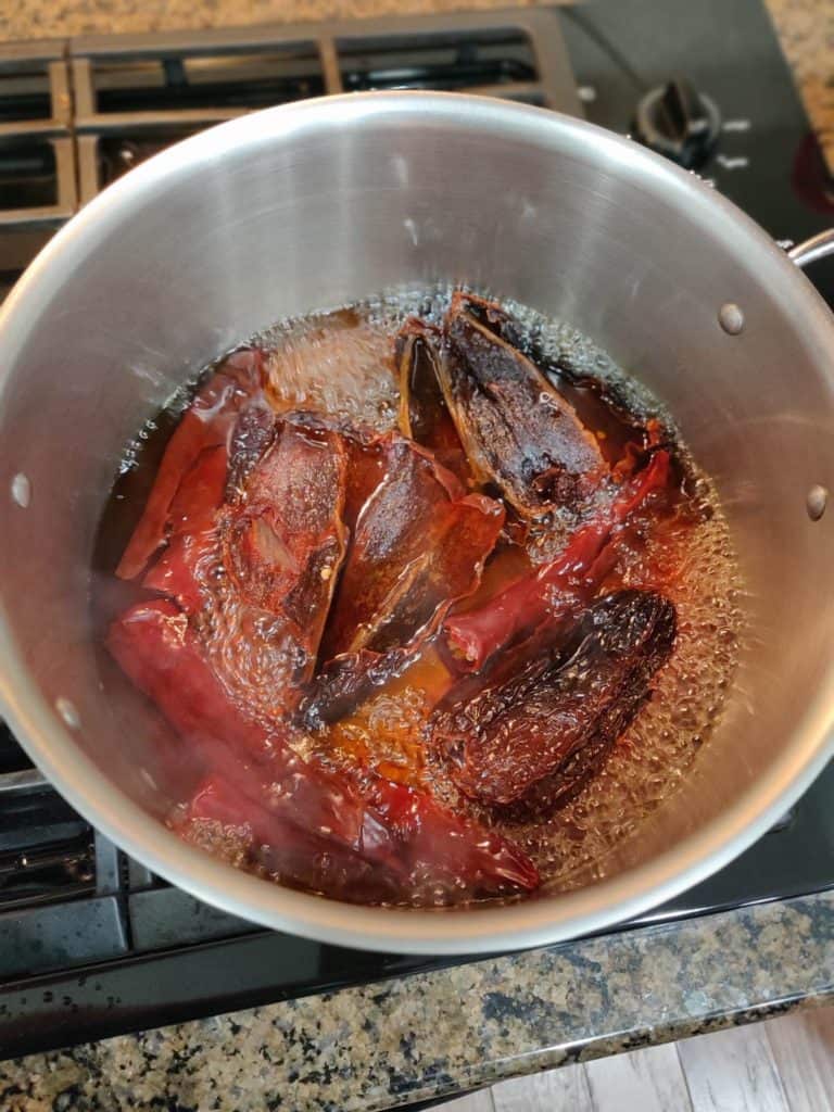Chili Peppers in boiling water in pot