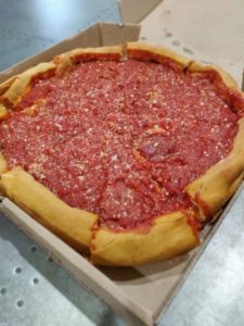 Deep dish pepperoni pizza in box