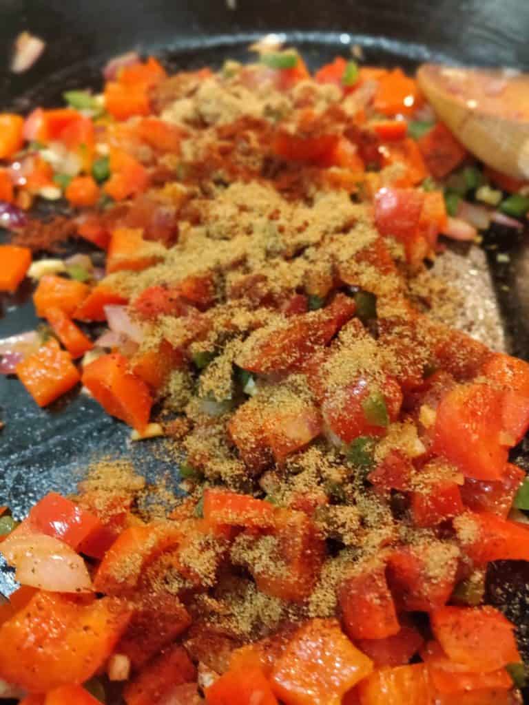 Tomatoes and spices in pan