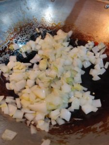 Chopped onion in wok pan