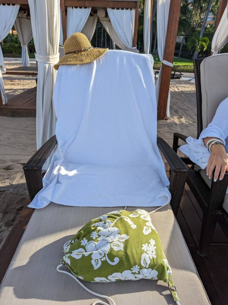 Lounge chair with towel, bag and hat