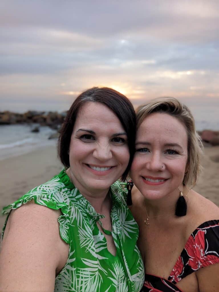 Dusti and Heather on the beach at sunset