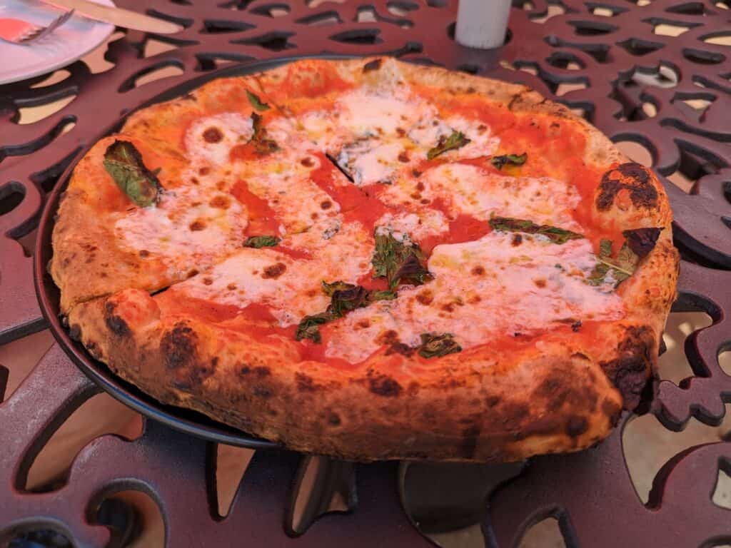 Saucee Sicilian margarita pizza on table