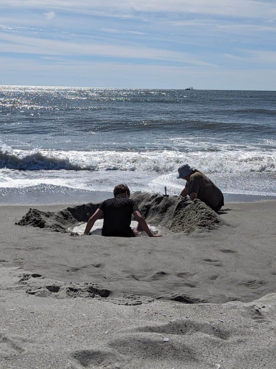 Tyler and Cole digging hole on the beach