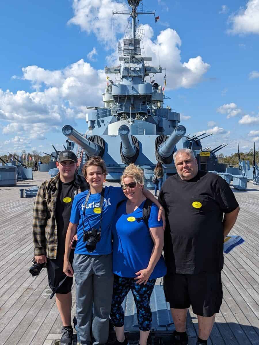 Mike, Shelly, Tyler and Cole standing on the top deck of the naval ship