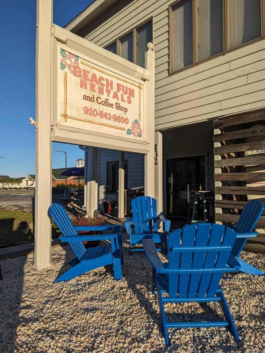 Beach fun rentals sign with blue chairs