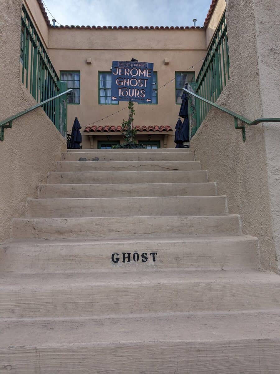 Stairs leading up to Ghost Tours sign in Jerome, AZ